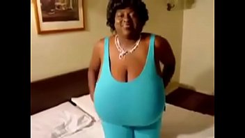 Ebony mature Black woman shows off Monster tits . all natural udders