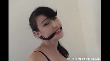 Natalie Minx bound and gagged on a stool