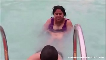 Hindi 47 yrs old married hot swim trainer aunty showing and jiggling her boobs during training session to 26 yrs old guy at the swimming pool porn video.