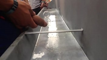 Guys caught pissing in community urinal