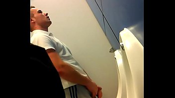 White boy caught showing his dick at urinal